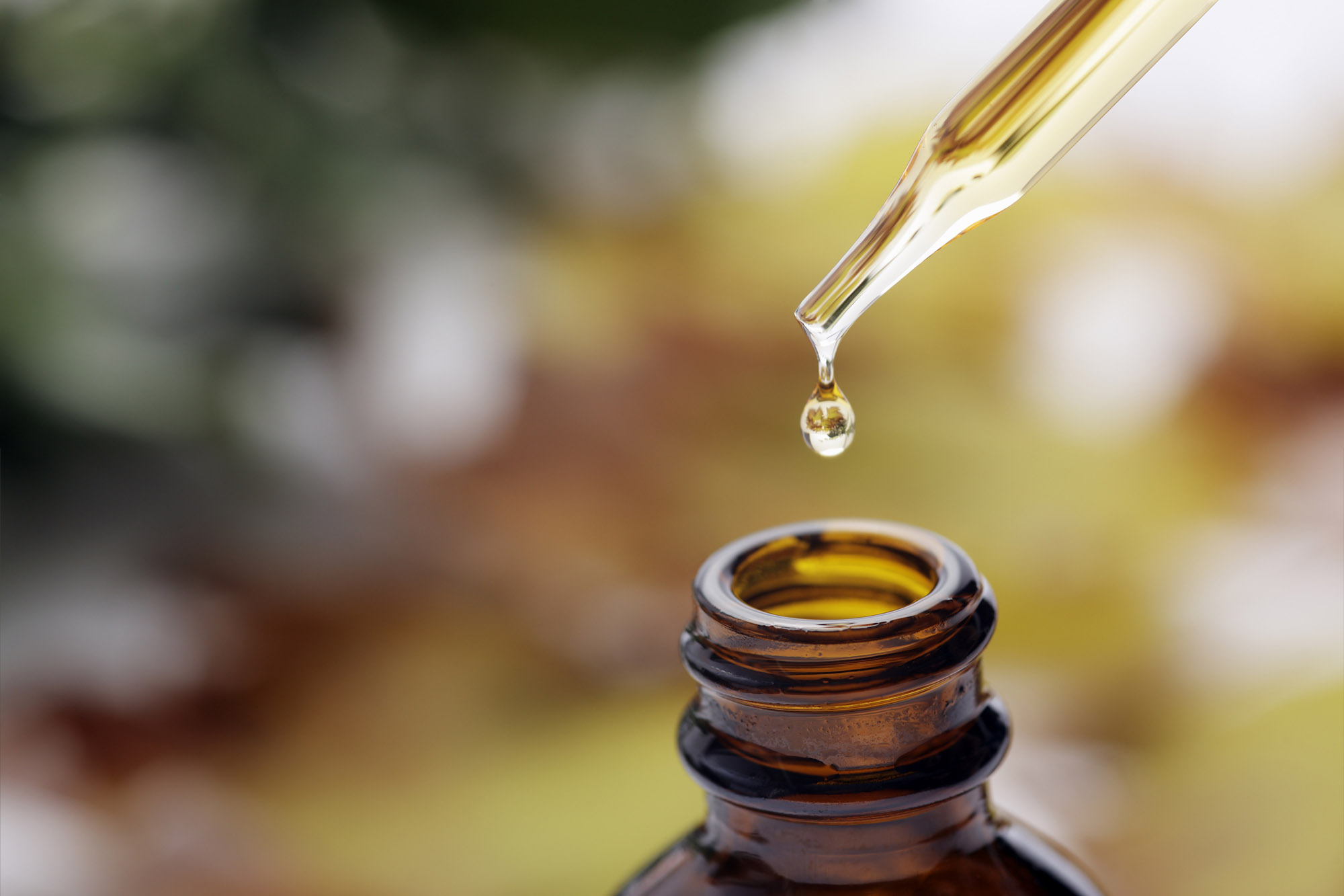 Brown herbal extraction bottle with a dropper.